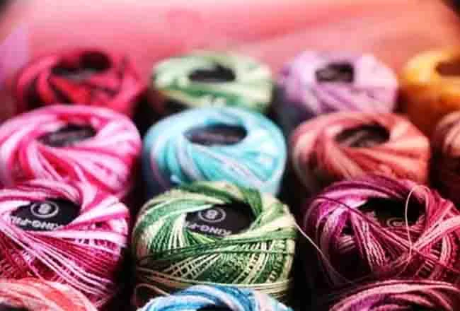 Balls of cotton knitting yarn in variegated colours