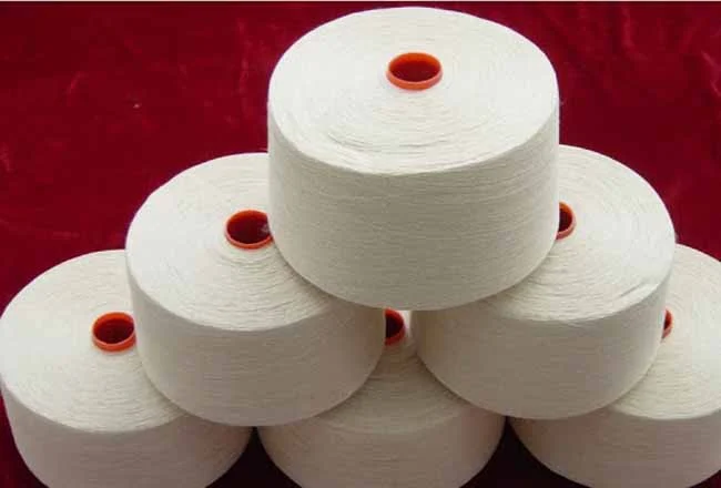 Cones of natural organic cotton knitting yarn