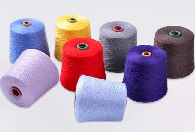 Cones of cashmere-blend yarn in soft seasonal colours