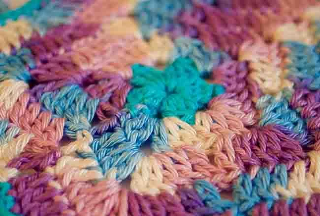 Hand-crocheted multicolour granny-square knit detail by lpknit